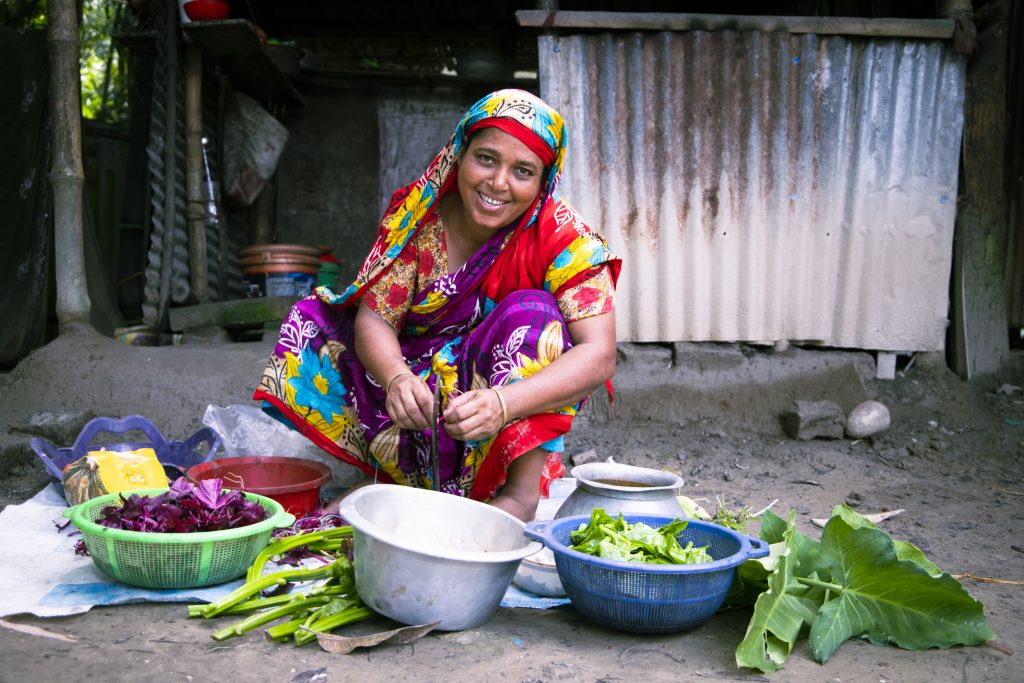 Feroza Begum preparing vegetables from her homestead garden